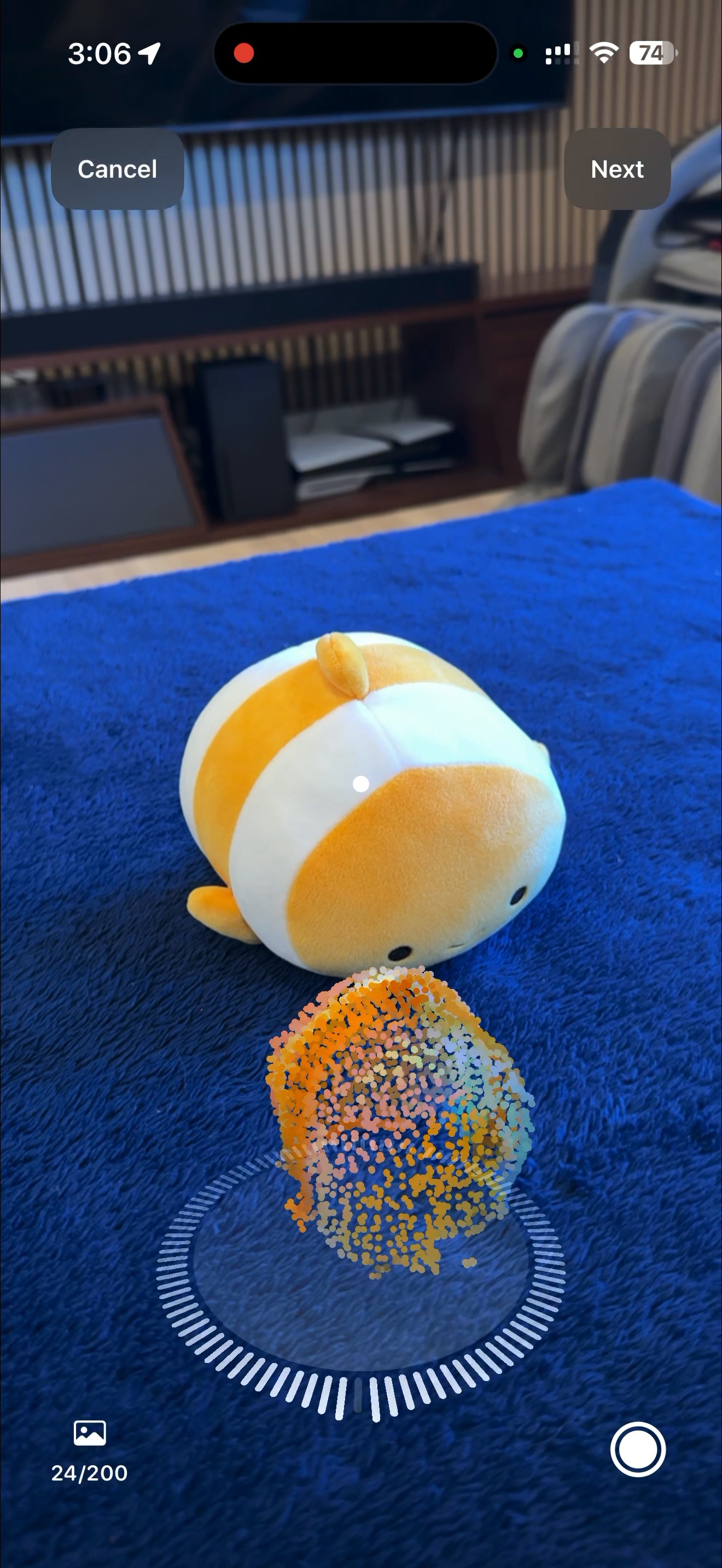 iPhone capturing 3D scan images while walking around an object with point cloud visualization