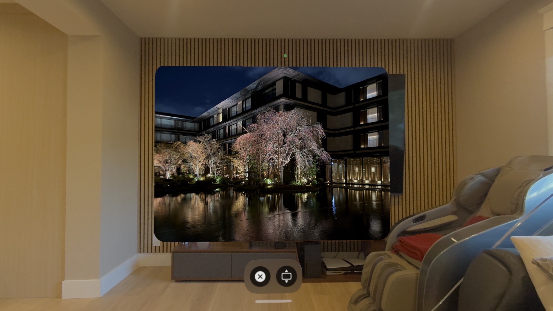 Spatial photo displayed in a floating window on Apple Vision Pro showing a nighttime Japanese garden